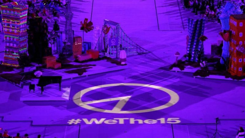 Wethe15 emblem lights up on the stage floor.