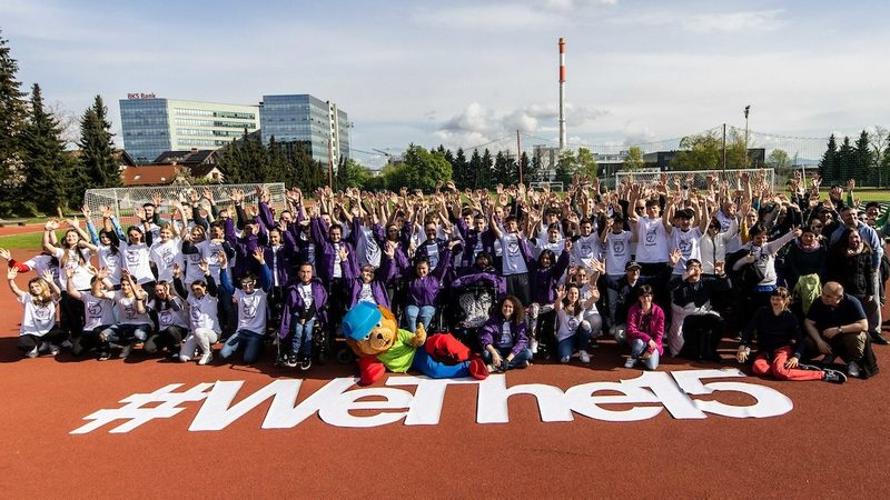Group picture of athletes and para-athletes in front of WeThe15 text in white